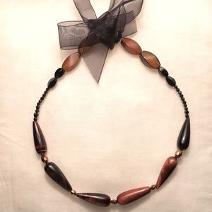 Beautiful Beaded Necklace with Black Ribbon tie.